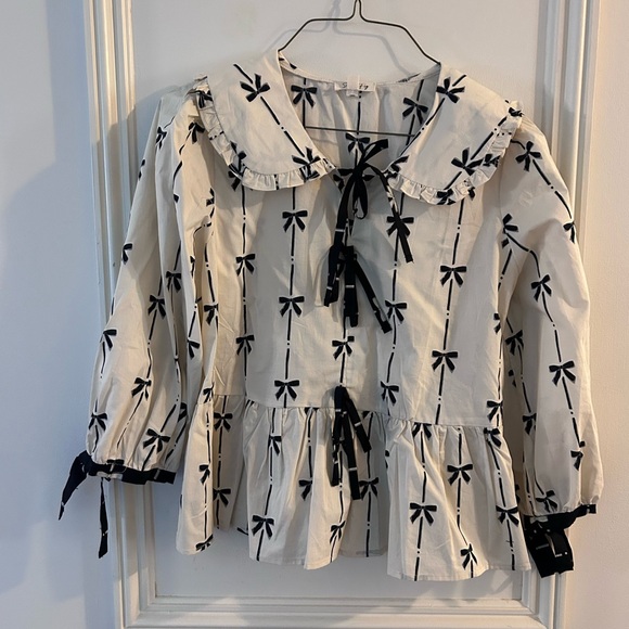 Sage + Fig Tops - Ruffled Bow-Print Peplum Blouse in Ivory and Black